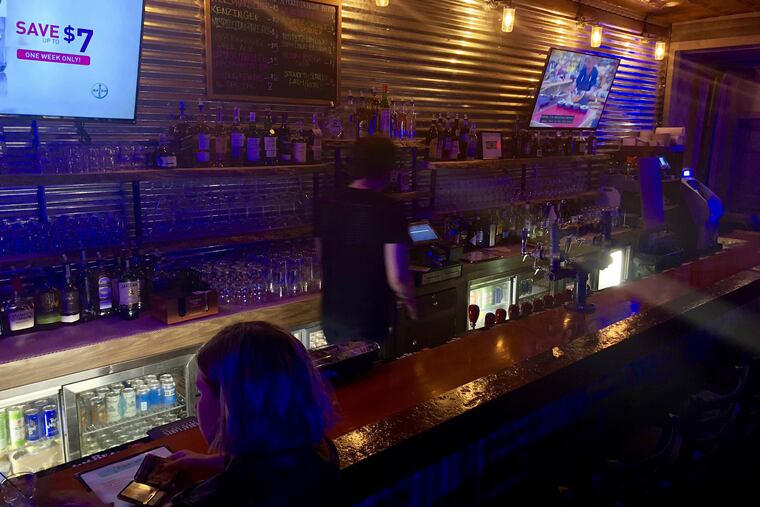 Bathed in blue light, the Wander Inn is new at Third and Porter Streets in South Philadelphia.