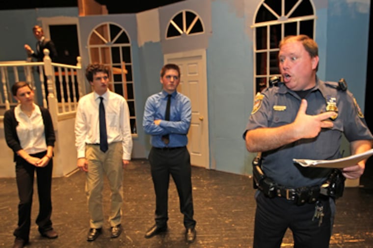 Gee, Officer Krupke. ... Abington police detective Robert Allmond gives some guidance to young actors (from left) Lauren Bertino, Seth Goldberg, and Kyle Sukley during a rehearsal of the play “Rumors” at Abington High. MICHAEL BRYANT / Staff Photographer