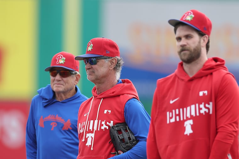 Phillies interim manager Don Mattingly (center) says Bryce Harper (right) "is going to say what he wants, so I’m not really concerned about it."