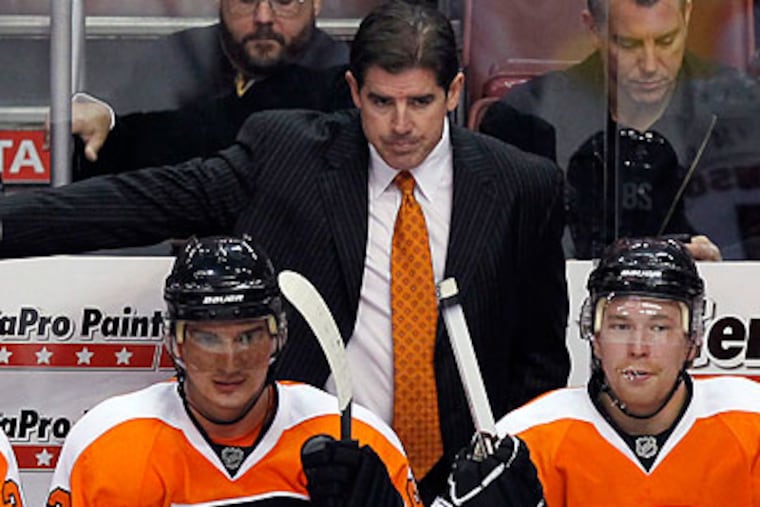 "I'm really happy with the way the guys have played," Flyers coach Peter Laviolette said. (Yong Kim/Staff file photo)
