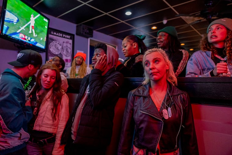 Eagles fans at Reale’s Sports Bar and Grill at Frankford and Cottman in Mayfair mourn the Eagles loss on Sunday.