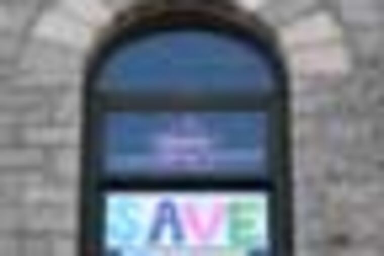 Signs campaigning for the school to be kept open hang in the window at Isaac Sheppard Elementary. EDITORS NOTE: The Philadelphia School District might close Isaac Sheppard Elementary, a tiny K-4 school in Kensington. The building is more than 100 years old. It consistently meets state standards and is a safe, welcoming spot in a community battered by violence, gang activity and a drug trade. ( Charles Fox / Staff Photographer ) RRXSHEPPARD04P, 2/28/2012, Isaac Sheppard Elementary, 120 W. Cambria St., Philadelphia, PA