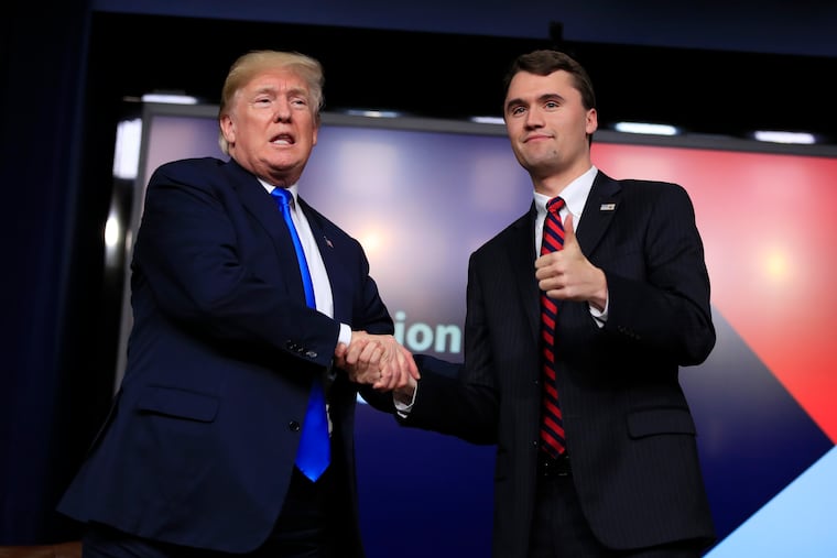 President Donald Trump shakes hands with Charlie Kirk at the White House in March 2018. In the wake of Kirk's death, the Editorial Board writes, America yearns for measured leadership. But it is not coming from Trump.