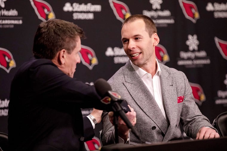Arizona Cardinals owner Michael Bidwill, left, shakes hands with new coach Jonathan Gannon during a news conference on Thursday.