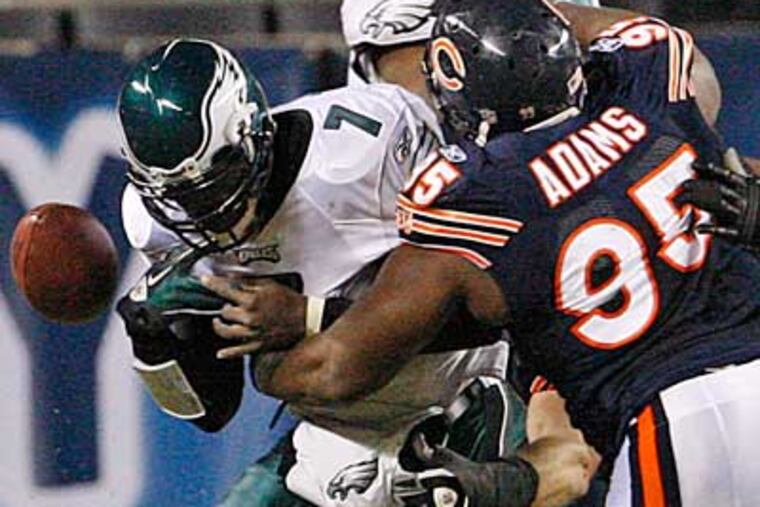 Michael Vick was sacked four times in Sunday's loss to the Bears. (Ron Cortes / Staff Photographer)