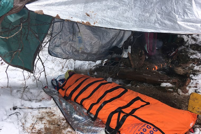 In this Sunday, Feb. 17, 2019, photo provided by the National Park Service. a rescued hiker is treated after being stuck in quicksand after getting stranded in a creek Saturday, Feb. 16, 2019, in Zion National Park, Utah. The Zion Search and Rescue team took several hours, to locate the man who was stable but suffering from exposure, hypothermia, and extremity injuries. (National Park Service via AP)