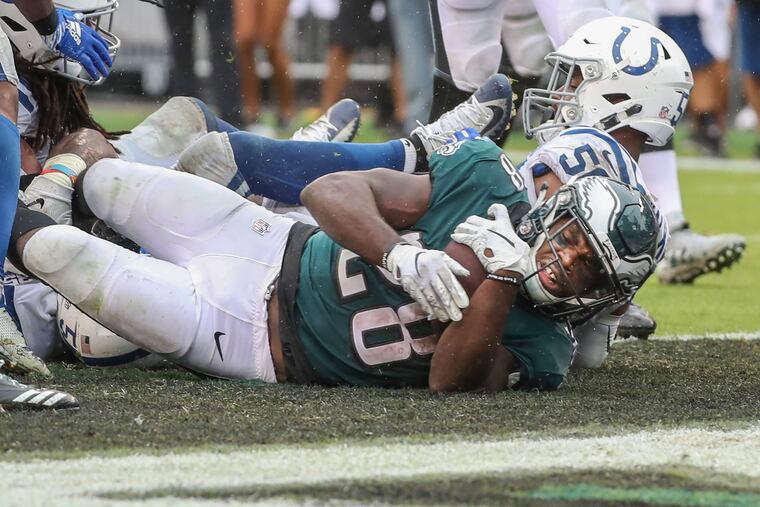Eagle running back Wendell Smallwood crashes over the goal line in the fourth quarter to give the Ealges the lead 19-16 on Sunday , September 23, 2018. Eagles went on to win 20-16. MICHAEL BRYANT / Staff Photographer