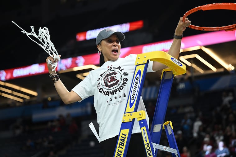 South Carolina head coach Dawn Staley reacts to the crowd after cutting down the net following South Carolina's 64-49 win over UConn in the NCAA Women's Final Four championship game on April 3 at Target Center in Minneapolis.