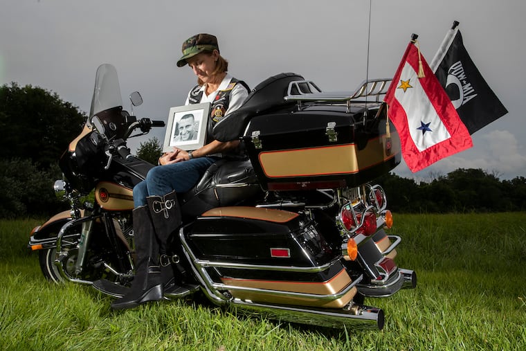 On Aug. 6 and Aug. 9, 2005, at the peak of U.S. efforts to quell rebel insurgency in Iraq, six members of National Guard Alpha Company of the 1-111th Infantry of Philadelphia were killed in two roadside bomb attacks. Kim DeTample, mother of one of those soldiers, Nate DeTample (in framed photo), has channeled her grief into helping veterans and their families.