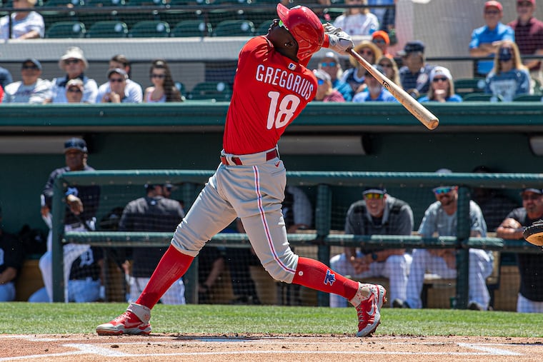 Philadelphia Phillies' Didi Gregorius hits a two-run home run in the fifth inning of a spring training baseball game against the Detroit Tigers at Joker Marchant Stadium in Lakeland, Florida.