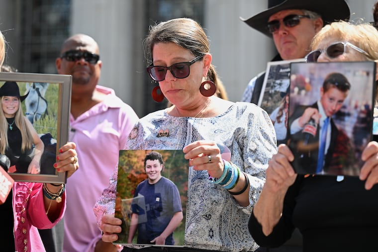 Mary Rodee holds a photo of her son Riley after the verdict in a landmark trial over whether social media platforms deliberately addict and harm children at Los Angeles Superior Court, Wednesday, March 25, 2026, in Los Angeles.
