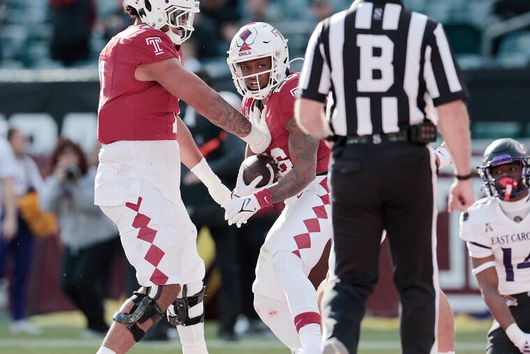 Temple running back Keveun Mason (right) celebrates his second-quarter touchdown during Saturday's loss to ECU.