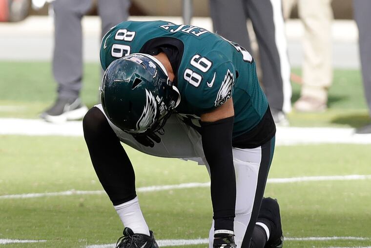 Eagles tight end Zach Ertz takes a knee after getting hurt during the fourth quarter against the Baltimore Ravens on Sunday.