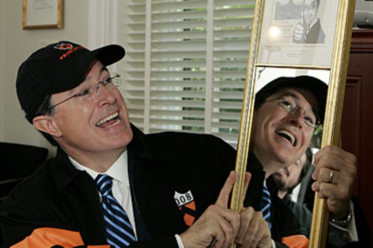 Colbert, sporting a Princeton cap and jacket, holds up the mirror-mounted "Vanity" award presented to him after his Class Day address.