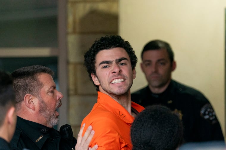 Suspect Luigi Mangione is taken into the Blair County Courthouse on Tuesday, Dec. 10, 2024, in Hollidaysburg, Pa.