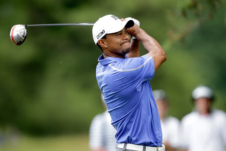 Tiger Woods follows his tee shot off #2 during the first round of the U.S. Open at Merion.( YOUNG KIM / Staff Photographer )