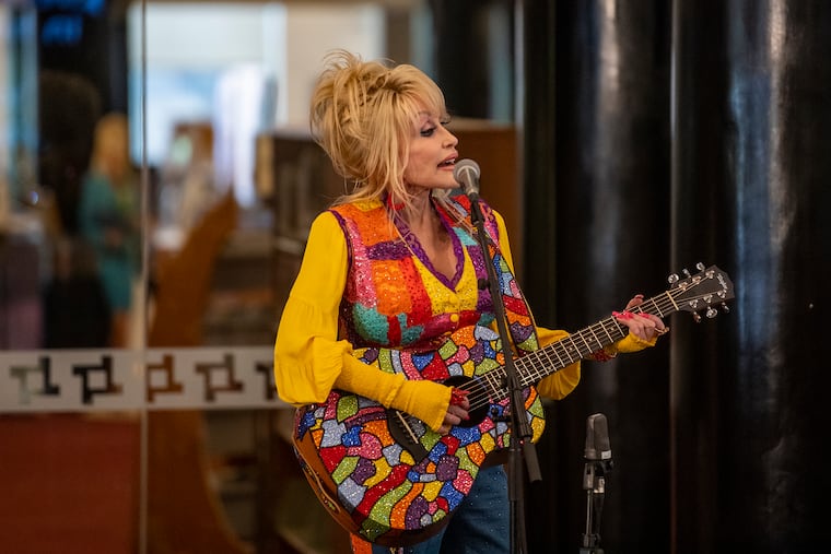 Dolly Parton performs at the Wilmington Public Library in Wilmington, Del. in May 2022 to promote her Imagination Library, a free book-gifting program for children.