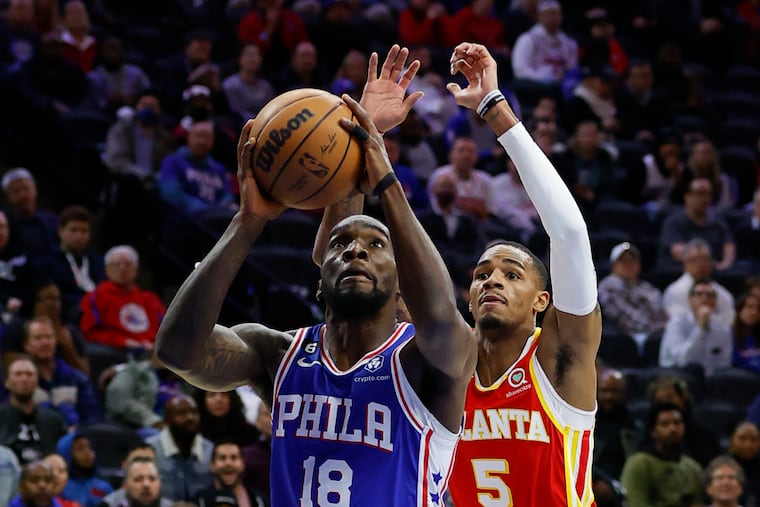 Sixers guard Shake Milton drives to the basket against Atlanta Hawks guard Dejounte Murray on Monday.