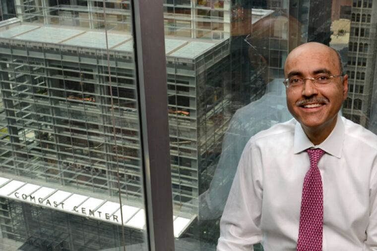 Imrah Shah, one of the leading consults in the cable-TV industry, poses in his office across from the Comcast Corp. Center, June 28, 2103. ( TOM GRALISH / Staff Photographer )