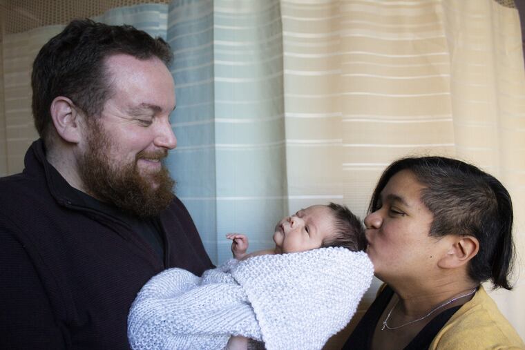 Brendan and Mo, with baby Rex.