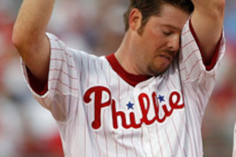 Phillies pitcher Adam Eaton can't take the heat generated by St. Louis' bats. He gave up six runs before being yanked in the fifth.