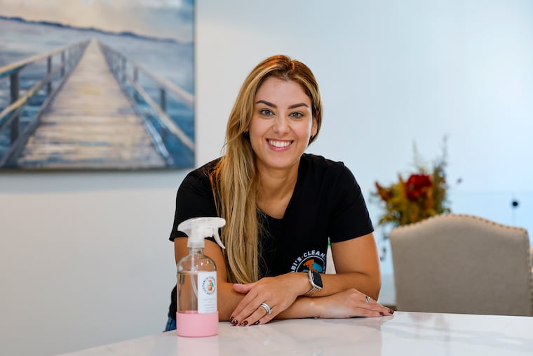 Fabiana Pons, owner of Fabi's Cleaning Services, poses at the home of a client in Graduate Hospital earlier this month. Pons said the last few months, usually a slow time, have been especially busy.