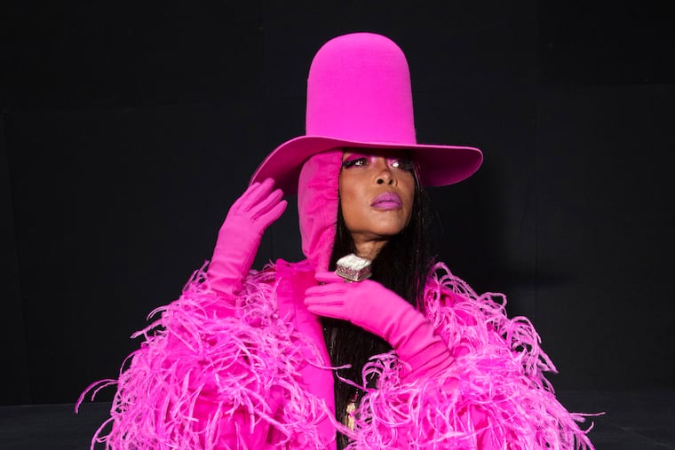 FILE. - Erykah Badu arrives at the Valentino ready-to-wear Spring/Summer 2023 fashion collection in Paris in 2022. The R&B and funk singer and bandleader will headline the Roots Picnci on May 31. (Photo by Vianney Le Caer/Invision/AP, File)