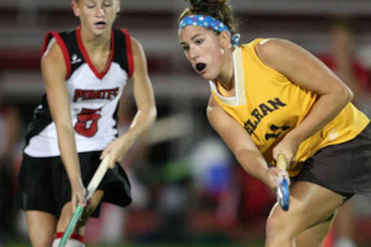 Delran's Paige Mollineaux (right), who scored one of her team's two goals, passes the ball as Cinnaminson's Ashlee Lippincott moves in. The win avenged an earlier tie with the Pirates.