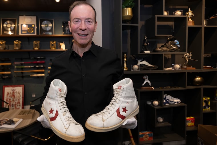 Ken Goldin holds a pair of Converse basketball sneakers on Thursday, Dec. 11, 2025, that belonged to 76ers star Julius “Dr. J” Erving and were worn during a game against the Boston Celtics in the 1980s. Goldin, the star of Netflix’s "King of Collectibles," the South Jersey- based collector and high-profile dealer has several new finds sure to excite Philadelphia sports fans.