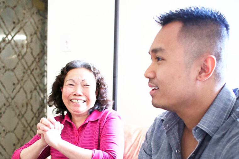 Thai Vong and his mother, Phi Chan, who escaped the Khmer Rouge in Cambodia, poses for a photo Saturday March 8, 2014, in the Olney section of Philadelphia. When he was in high school, Thai promised he'd take his mother back to Cambodia to see her family one more time. He began saving and this month, the mother and son will travel to Cambodia and she will see her family for the first time in 40 years. (For the Daily News/ Joseph Kaczmarek)