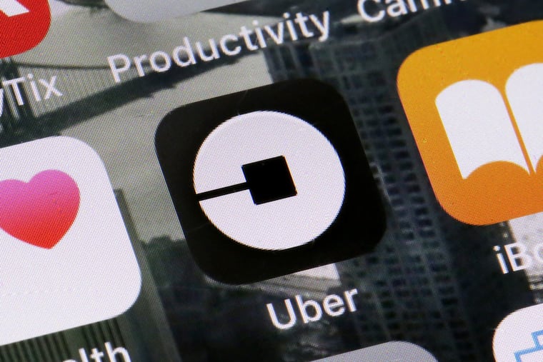 This Tuesday, June 12, 2018, file photo shows the Uber app on a phone in New York.