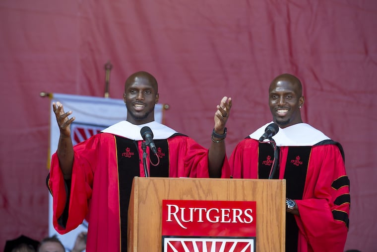 Jason McCourty (left) and Devin McCourty, Rutgers graduates and members of the New England Patriots Super Bowl championship team, speak at the university's commencement in New Brunswick.