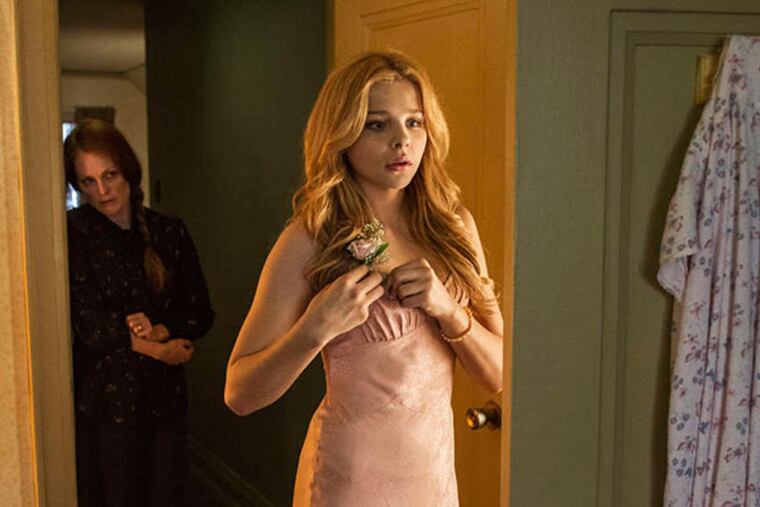 Julianne Moore, left, and Chloe Moretz, in a scene from, "Carrie." (AP Photo/Sony Pictures, Michael Gibson)