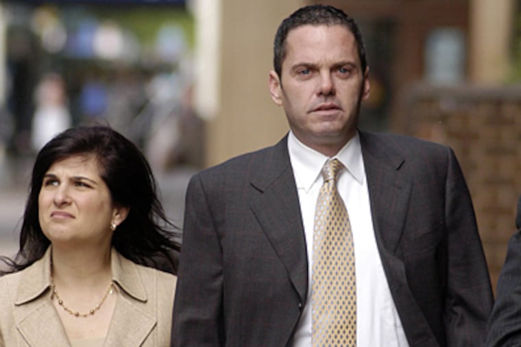 Donald "Gus" Dougherty, with his wife Dana, outside Federal Court, where he pleaded guilty to criminal charges involving his business.