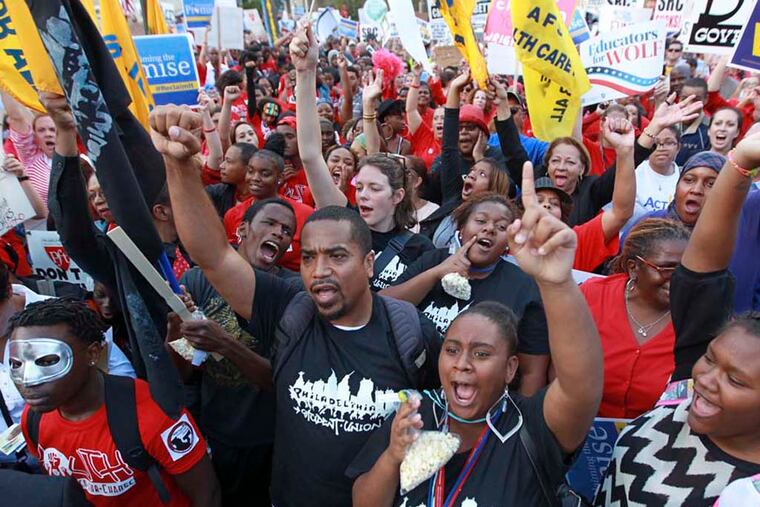 Philadelphia students and teachers in front of the school district headquarters in October, protesting the SRC's action voiding teachers' contracts. ( MICHAEL BRYANT / Staff Photographer )