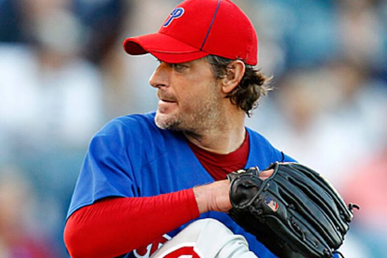 Jamie Moyer throws in the second inning of a spring training baseball game against the New York Yankees. (AP Photo/Mike Carlson)