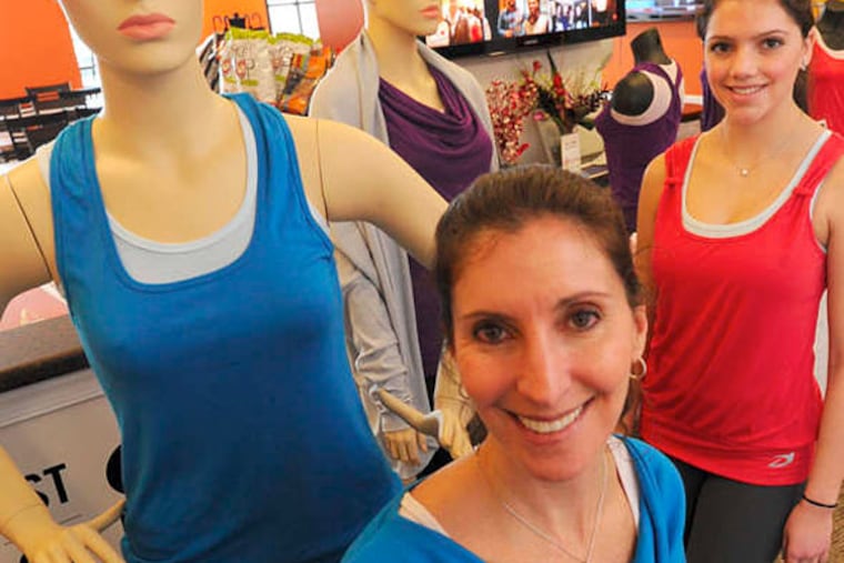 Nadine Gelberg, founder of Devigi, with her clothing and daughter Haley, 15. (April Saul / Staff Photographer)