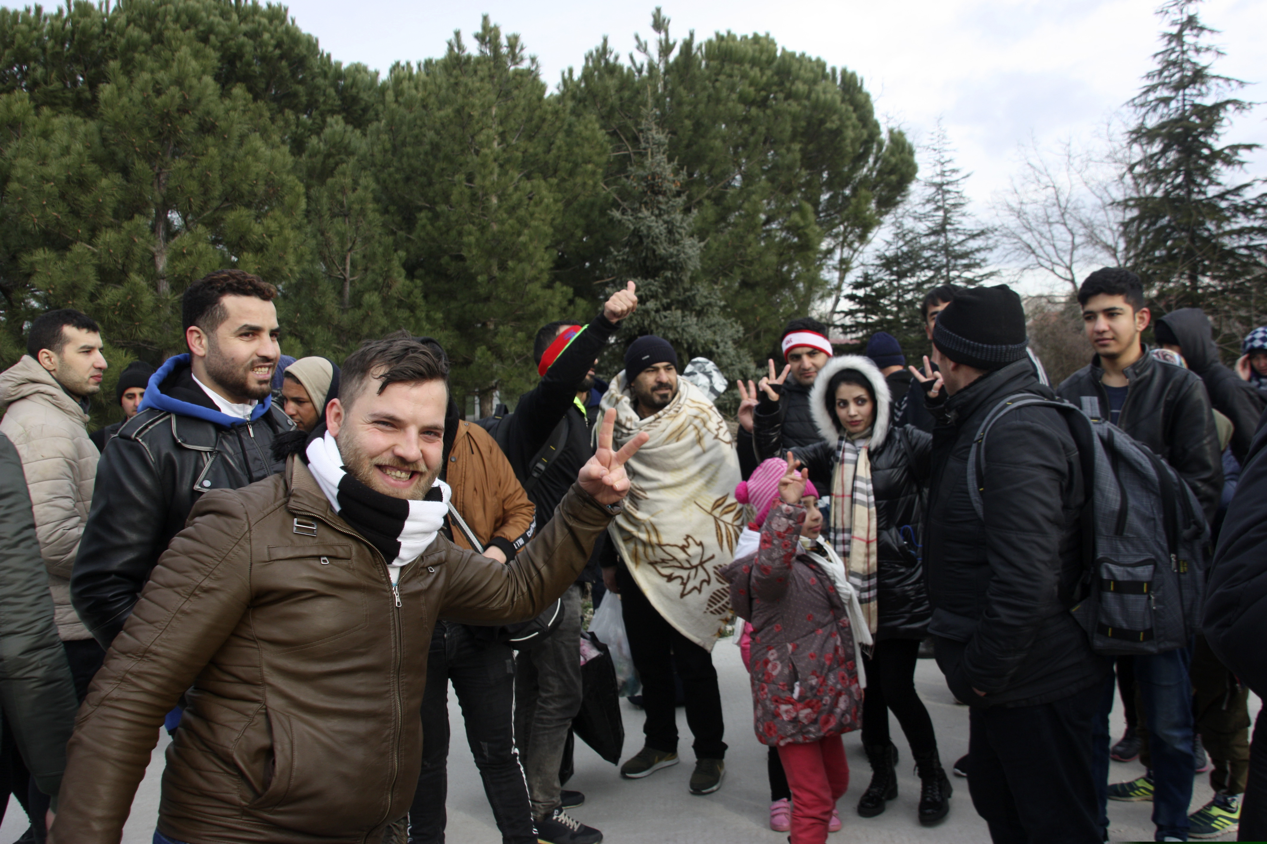Migrants react as they walk to the border gate of Pazarkule in Edirne, near Turkey-Greece border, early Friday, Feb. 28, 2020. An air strike by Syrian government forces killed scores of Turkish soldiers in northeast Syria, a Turkish official said Friday, marking the largest death toll for Turkey in a single day since it first intervened in Syria in 2016.