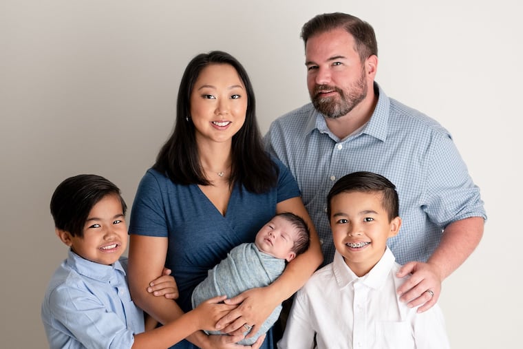 Christine and James Coyne with kids Archer (left), baby Miles and Logan (right).