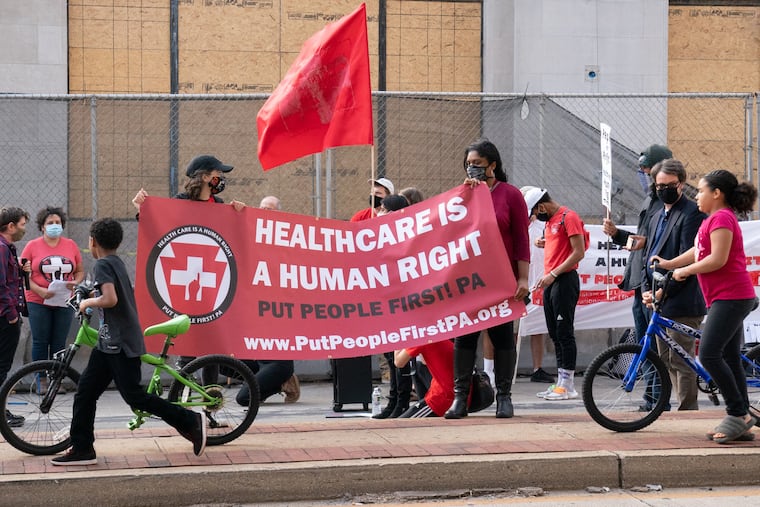 People protest in favor of Medicaid for All on Oct. 1, 2020, in Philadelphia.