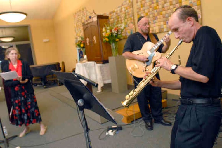 During a service in Warrington , cantor Joan Sacks provides vocals for guitarist David Madden and sax player Walt Beier. A keyboardist and drummer also are part of the ensemble. Rabbi Jon Cutler said he was hoping to keep members of his prayer group engaged.