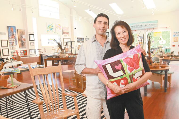 Jake Steel, left, manager of Earth, Wood & Fiber, and his mother Vicki Steel, owner of the store in Newtown Square. (MICHAEL BRYANT/Staff Photographer)