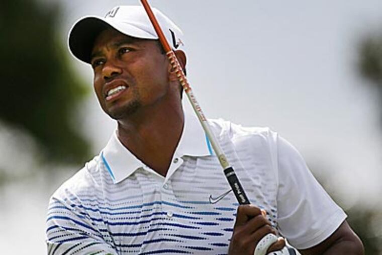Tiger Woods owns a share of the lead in the Tour Championship. (John Bazemore/AP)