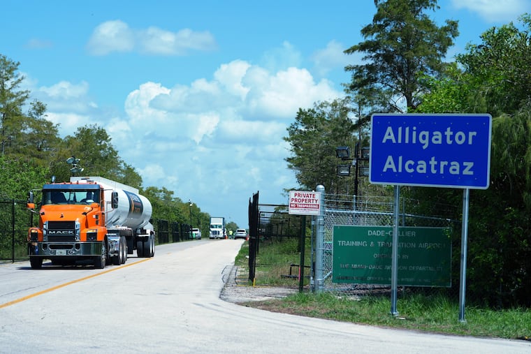 Trucks come and go from the "Alligator Alcatraz" immigration detention center in the Florida Everglades on Aug. 28, 2025.