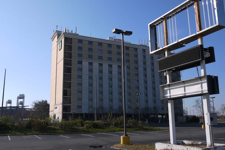 Demolition of the former Holiday Inn at 900 Packer Avenue near the South Philadelphia complex has stalled while Stadium Casino LLC undergoes a corporate restructuring. Stadium Casino, a partnership of The Cordish Companies and Greenwood Racing, parent company of Parx Casino, has also asked state gaming regulators for a three-year extension on when it begins operations. (ANDREW MAYKUTH / Staff)