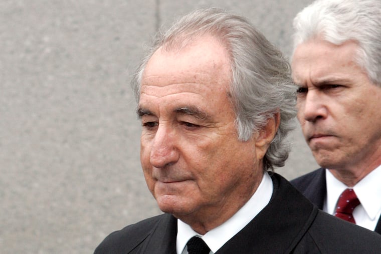 In this March 10, 2009 photo, former financier Bernie Madoff leaves federal court in Manhattan, in New York.