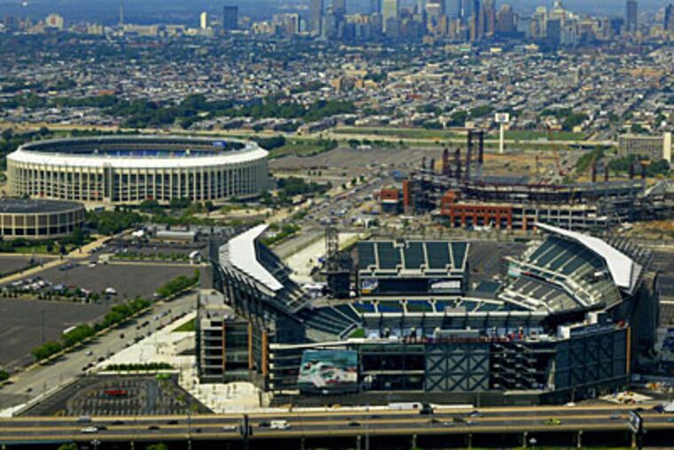 Lincoln Financial Field, foreground, which became the new home of the Eagles in 2003, is shown with other sports complex buildings, including Veterans Stadium (before it was knocked down) and Citizens Bank Park, the Phillies' new ballpark. (AP Photo/George Widman)