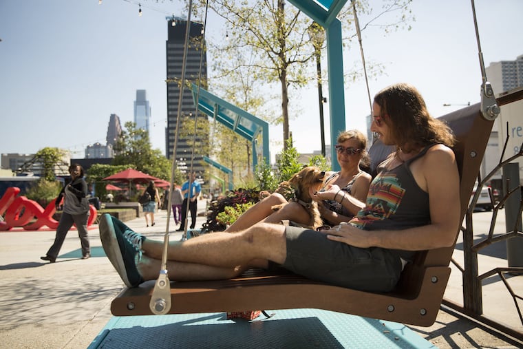 At midnight on Oct. 31, the University City District will relinquish stewardship of the Porch at 30th Street Station to Amtrak as part of the 30th Street Station District plan. UCD's furniture and installations, such as the popular swings in this photo, will be removed, and Amtrak will construct a larger, enduring plaza outside its historic train station.