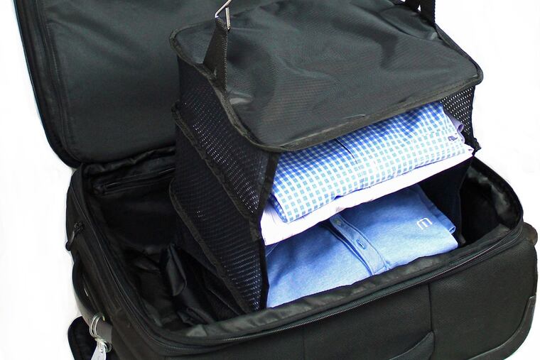 The Stow N Go Hanging Travel Shelves is a three-tier nylon-and-mesh shelving unit that collapses atop its own integrated zippered packing cube (well, cuboid, since one side om the large size is rectangular), compresses with a push, then latches shut with built-in plastic clip buckles