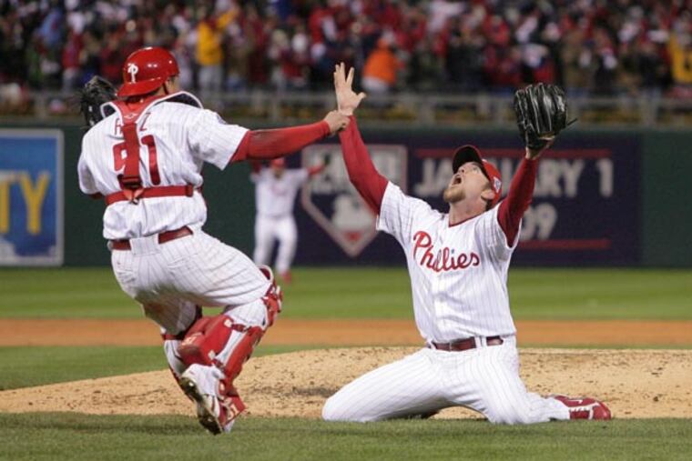 Brad Lidge and Carlos Ruiz celebrate winning it all after the end of the ninth inning. ( Jerry Lodriguss / Staff Photographer ) (The Philadelphia Inquirer and Daily News) The Philadelphia Phillies faced the Tampa Bay Rays in game five of the World Series at Citizens Bank Park on Wednesday October 29, 2008.